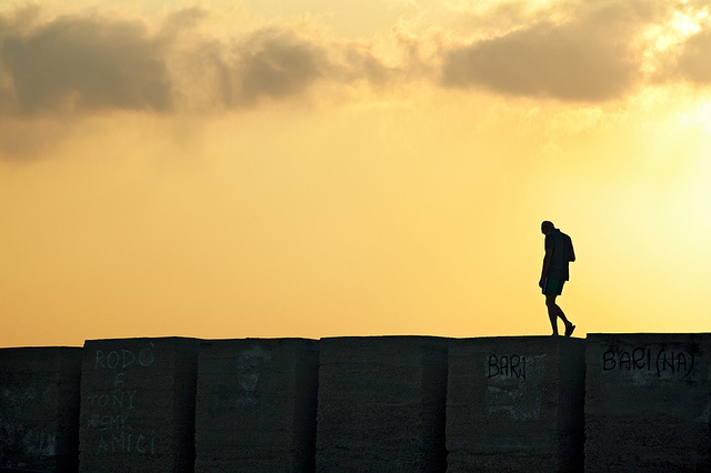 Lonely Man Walking on the Edge